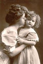 an old photo of two women and a child with the caption mother's love