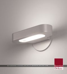 an image of a modern light fixture with dimmer on the wall in white color