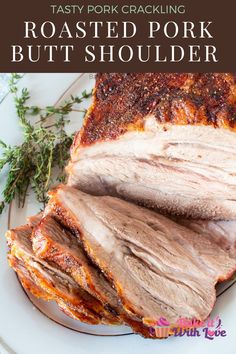 roasted pork on a plate with rosemary sprigs and text overlay that says roasted pork but shoulder