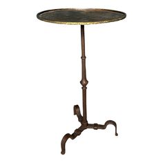 a table with a metal base and an iron stand on it's legs, against a white background