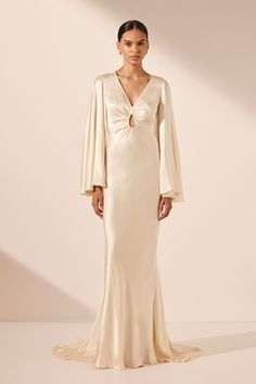 Luxury Flowy Maxi Dress With Sheer Sleeves, Luxury White Maxi Dress With Gathered Sleeves, Luxury Flowy Lantern Sleeve Dress, Luxury Cream Dress With Sheer Sleeves, Luxury Long Sleeve Flowy Maxi Dress, Luxury Cream Chiffon Dresses, Luxury Off White Maxi Dress For Wedding, Luxury Silk Dresses With Lace Sleeves, Luxury Cream Lace Long Sleeve Dress