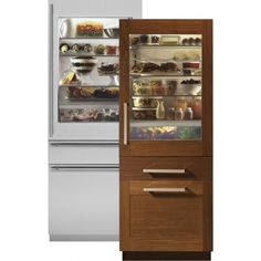 three refrigerators with food in them sitting side by side