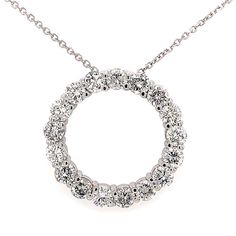 This is our magnificent Circle of Love pendant necklace in 14 kt white gold! This classic circle pendant has an amazing 7.00 ct. total weight of immaculately clean SI-1 clarity and brilliantly white F color diamonds set in a never ending circle on this pendant. A 16 inch cable link chain loops through the hidden bale of the pendant and this secures to the neck with a lobster claw closure. White Halo Diamond Necklace, White Round Halo Diamond Necklace, Round Cut Halo Diamond Necklace For Anniversary, Anniversary Round Cut Halo Diamond Necklace, Anniversary White Gold Halo Diamond Necklace, Anniversary Halo Diamond Necklace With Round Cut, Classic Round Diamond Necklace With Halo Design, Round Diamond Necklace With Halo Setting For Anniversary, Platinum Halo Design Round Necklace