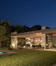 an exterior view of a modern home at night