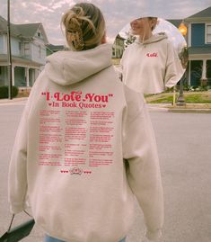 the back of a woman's sweatshirt that says i love you in book quotes