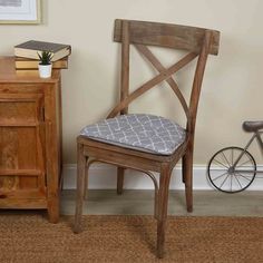 a wooden chair sitting next to a dresser