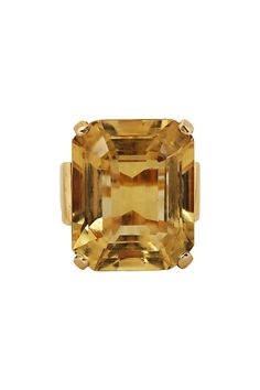 A boldly scaled Retro ring featuring a magnificent citrine of approximately 40 carats highlighted at either side by a tailored trio of graduating scrolls of gold. CREATOR Unknown PERIOD Retro STONE Citrine STONE CUT Rectangular Step Cut INVENTORY NUMBER 19554 PLACE OF ORIGIN United States METAL 14K Yellow Gold CONDITION Excellent Luxury Topaz Baguette Cut Ring For Formal Occasions, Luxury Formal Topaz Ring With Gemstone, Luxury Formal Topaz Gemstone Ring, Luxury Formal Baguette-cut Topaz Ring, Luxury Formal Baguette Cut Topaz Ring, Luxury Formal Topaz Ring, Luxury Gold Topaz Ring, Elegant Formal Topaz Ring With 17 Jewels, Elegant Yellow Gold Topaz Ring For Formal Occasions