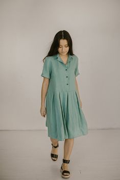 "Eva - below the knee button front linen dress with pockets and short sleeves Qualities of this flowy pleated skirt dress: - made from Oeko-Tex certified 100 % European linen fabric which guarantees you that it meets human - ecological requirements. The linen fabric is of medium weight (185 g). - if your feel that you need to add extra length - do not hesitate to contact us. - in the pictures, you can see a Mint green plus size linen bridesmaid dress. Please choose any other color on the right. Flowy A-line Pleated Dress For Summer, Summer A-line Midi Dress With Pleated Waist, Short Sleeve Pleated Midi Dress For Vacation, Casual Pleated Summer Dresses, Casual A-line Midi Dress With Pleated Waist, Summer Pleated Midi Dress For Daywear, Casual Flowy Pleated Midi Dress, Summer Midi Dress With Pleated Hem For Daywear, Flowy Pleated Midi Dress Casual