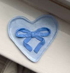 My Blue bow heart clay tray by Handmade. Size for £24.00: https://www.vinted.co.uk/items/3535628096-blue-bow-heart-clay-tray. Bow Clay Art, Bow Jewelry Dish, Jewellery Tray Clay, Blue Clay Ideas, Heart Clay Ideas, Heart Clay Tray, Clay Room Decor, Clay Heart, Clay Tray Ideas