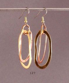 handmade earrings Copper & Brass elongated hoops  also available Brass & Nickle-silver combo  5/8" x 1 3/4" Etsy Earrings Dangle, Copper Earrings, Handmade Earrings, Festival Season, Dangle Earrings, Jewelry Earrings, Hoop Earrings, Accessory Gift, Copper