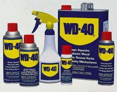 the contents of a wd - 40 car are shown in this image, including two spray cans and one bottle