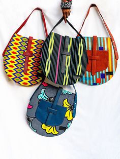 The new sturdy handmade Akoa bag is perfect for every day wear. For work or trips, can safely carry up to 4kg. Its unique shape is inspired by a flat oval traditional stone found in most households in Cameroon, central Africa. Which is used to crush spices . And we believe old methods bring out the best taste.  So, the fabrics used for these designs are ethically sourced in West-Africa. This bag will fit any laptop, makeup bag, a scarf. Leaving more space for additional items  such as: a cardhol Multicolor Shoulder Saddle Bag For Daily Use, Multicolor Saddle Bag For Everyday Use, Multicolor Satchel Saddle Bag For Daily Use, Handmade Tote Saddle Bag For Daily Use, Handmade Saddle Tote Bag For Daily Use, Handmade Saddle Bag Tote For Daily Use, Stylish Work Bag, Ankara Bags, Scarf Bag