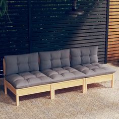 a couch sitting on top of a wooden bench