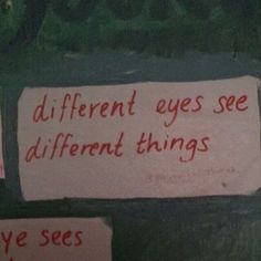 two signs that are on the side of a wall with words written in red and white