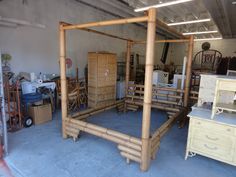 a room filled with lots of furniture and boxes on top of the floor next to each other