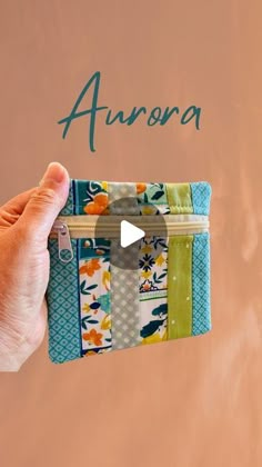 someone is holding an item in their hand with the word aurora written on it,