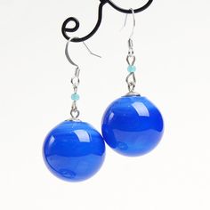 "These Blue ball dangle earrings are good for everyday outfits and for special occasions. They can be a great gift for her! Dimensions: total length is 2\" inch (5cm), ball diameter 0.9\" inch (2.2cm). Materials: artist lampwork glass beads, silver plated hooks. Colors used: blue. For your information: ✦ Get free shipping when you buy any two or more items! ✦ All jewelry is shipped with some kind of gift wrapping, box or bag depending on size. ✦ Your order will be packed very carefully and will Trendy Blue Round Bead Earrings, Trendy Light Blue Drop Earrings, Trendy Light Blue Dangle Earrings, Trendy Blue Dangle Earrings, Trendy Blue Drop Earrings, Blue Dangle Earrings With French Hook, Blue Hypoallergenic Round Bead Earrings, Blue Hypoallergenic Earrings With Round Beads, Minimalist Blue Earrings With Ear Wire