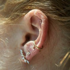 Oh look! The tiniest fairy wings have perched upon your earlobe! Set with the tiniest diamond for extra sparkle. Sold as singles. See Details for item specifics. Dainty Single Ear Climber For Parties, Delicate Single Cartilage Earring, Dainty Single Cartilage Earring For Party, Laurie Fleming, Tiny Diamond, Fairy Wings, Sell Gold, Mother Pearl, Gold Collection