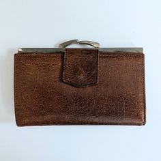 A vintage 1960s ladies leather purse in brown Montana Calf leather.   The purse has a clasp to close and the inside section of the purse has two compartments for coins There is a side wallet which opens out to hold notes and there is a section for a pass/driving licence etc. Additionally there is a zipped compartment  The purse measures 14cm x 9.5cm when closed Very good condition and clean inside Vintage Brown Wallet For Travel, Vintage Brown Travel Wallet, Brown Formal Coin Purse With Coin Pocket, Vintage Wallets With Snap Closure, Classic Brown Coin Purse For Formal Occasions, Vintage Wallets With Snap Closure For Everyday Use, Vintage Bifold Coin Purse For Travel, Formal Brown Coin Purse With Coin Pocket, Vintage Travel Wallets With Coin Pocket