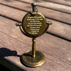 an award is placed on top of a wooden bench in front of the camera lens