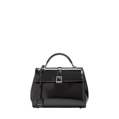 Saint Laurent "Le Fermoir" top handle bag in smoother leather  Flat top handle with removable logo tag  Detachable, adjustable shoulder strap Can be worn as a top handle or shoulder bag  Flap top with lift-clasp closure; adjustable side button straps  Silver-tone hardware Interior, one zip pocket  Feet protect bottom of bag  Approx. 4.7"H x 11"W x 1.6"D Made in Italy Luxury Box Bag With Silver-tone Hardware, Top Handle Bags With Silver-tone Hardware, Luxury Box Bag With Palladium Hardware, Luxury Office Satchel With Adjustable Handle, Luxury Office Bag With Adjustable Handle, Luxury Box Bag Satchel With Silver-tone Hardware, Luxury Box Bag With Silver-tone Hardware Satchel, Luxury Box Bag With Adjustable Handle For Travel, High-end Top Handle Box Bag With Detachable Strap