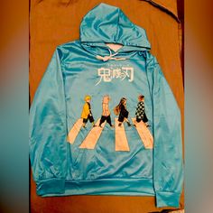 Adult Size Small Nwot Anime Hoodie Light Blue Graphic Print Sweatshirt For Winter, Casual Light Blue Hoodie With Letter Print, Winter Light Blue Graphic Sweatshirt, Light Blue Long Sleeve Hoodie With Letter Print, Blue Hooded Top For Streetwear, Blue Winter Hoodie With Graphic Print, Light Blue Hooded Sweatshirt With Letter Print, Light Blue Fleece Sweatshirt For Streetwear, Blue Hooded Outerwear With Letter Print