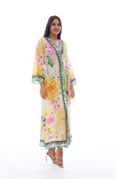 Charm your festival or beach look with this lightweight duster covered in a vibrant floral pattern. Open front Kimono-inspired sleeves 100% polyester Hand wash cold, lay flat to dry Imported Model stats: 5'10", 32" bust, 25" waist, 36" hip. Model is wearing size One Size. V-neck Floral Print Festival Cover-up, Summer Floral Print Maxi Kimono, Floral Print Maxi Kimono For Summer, Long Cover-up For Spring Festivals, Long Festival Spring Cover-up, Multicolor Print Kimono For Spring Beach Cover-up, Multicolor Floral Print Long Sleeve Kimono, Long Sleeve Kimono With Multicolor Floral Print, Long Sleeve Multicolor Floral Kimono