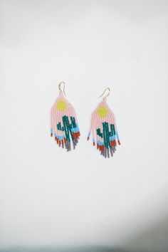 These boho beaded earrings are handcrafted from high quality Czech beads and metal components. You will be noticed everywhere with its unique colors and models. Earrings that you can use comfortably will add color to your style. These inspiring bead earrings are made of high quality Czech beads and metal components. **Avoid contact with creams and similar products. ♡Length - 2.75'' (7 Centimeters ) ♡Width - 1.18'' (3 Centimeters) ♡Stainless hooks ♥ Back to my shop:  https://www.etsy.com/shop/BejBeadedStore Unique Tiny Beaded Earrings For Festival, Unique Festival Earrings With Tiny Beads, Artisan Tiny Beads Earrings For Festival, Dangle Earrings With Tiny Beads For Beach, Artisan Earrings With Tiny Beads For Festival, Unique Beaded Earrings With Tiny Beads For Festivals, Unique Dangle Beaded Earrings With Tiny Beads, Unique Tiny Beaded Dangle Earrings, Unique Dangle Earrings With Tiny Beads