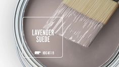 a paint can with a brush in it and the words lavender suede painted on it