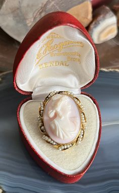 Item: Antique 10K Yellow Gold Natural Pearl Framed Cameo Brooch Pendant for Necklace. This is stamped 10K. The display box shown in the photos is not included. The chain is for demonstration purposes only and is not included. Measurements: 1 & 3/8th inches tall (including the bale). 1 inch wide. It weighs 6.49 grams. Condition: Antique, previously owned. There is no damage to note. There may be very minor signs of age/use. Please see our other listings, we combine shipping for savings. Antique Cameo Jewelry, Historic Jewelry, Vintage Cameo Jewelry, Art Deco Wedding Band, Cameo Jewelry, Vintage Cameo, Cameo Necklace, Cameo Brooch, Pearl Brooch