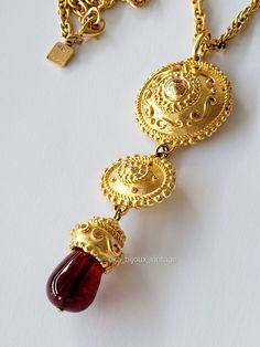 Beautiful vintage Ungaro Paris necklace in gold plated with a red glass pendant. Created in the 1980s. Very good general condition. Necklace length: 42cm. Dimensions of the pendant: L-10 cm, H-3.2 cm. Signed on the pendant and the chain: "Ungaro Paris, Made in France". Shipping worldwide by Colissimo with tracking and insurance. Delivered in its original Ungaro box. Do not hesitate to contact me for any additional information (mode of sending, request for additional photos...). Paris Necklace, Red Pendant Necklace, Red Pendant, Paris Vintage, Red Pendants, Red Glass, Necklace Length, Glass Pendant, Made In