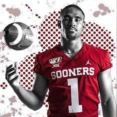 a man in a football uniform is holding a ball and looking up at the sky