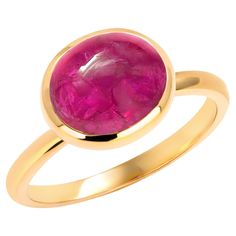 Introducing our exquisite Burma Cabochon Ruby Ring, a timeless piece of elegance and sophistication. This stunning ring features a mesmerizing 4-carat Burma cabochon ruby, renowned for its rich red hue and exceptional quality. Set in a lustrous 14-karat yellow gold bezel, this ring seamlessly combines luxury with classic charm. The centerpiece, the 4-carat Burma cabochon ruby, is skillfully crafted to showcase its natural beauty, with a smooth, rounded dome and a deep, alluring red color that captures attention with every glance. The bezel setting not only accentuates the ruby's brilliance but also provides a secure and stylish frame for the gemstone. The band, designed with meticulous attention to detail, is crafted from high-quality 14-karat yellow gold, adding a warm and radiant touch t Gemstone Solitaire Ring, Cabochon Ruby, Sapphire Solitaire Ring, White Gold Solitaire, Bezel Set Ring, Gold Solitaire Ring, Sapphire Solitaire, Contemporary Ring, Yellow Gold Setting