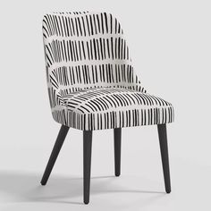 a black and white striped chair with wooden legs