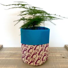 a potted plant sitting on top of a wooden table