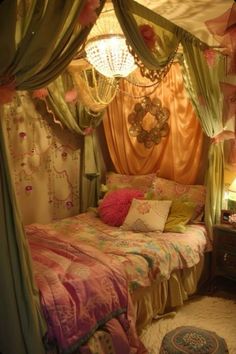 a bedroom with a canopy bed and curtains on the windowsills above it is decorated in pastel colors