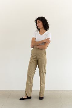 "These military khaki twill wide leg pants are the perfect addition to any wardrobe. They feature the following: zipper fly, straight wide leg, side pockets, back pockets, belt loops. Material: 100% Twill Cotton | Made in the USA in the 60s Condition: Excellent. Deadstock. Unwashed. Measurements: 24\" Waist Button / 34\" Hips / 13\" Rise / 11.5\" Thigh Flat / 31\" Inseam 25\" Waist Metal Tab / 35\" Hips / 13\" Rise / 11.5\" Thigh Flat / 31\" Inseam 26\" Waist Button / 35-36\" Hips / 13\" Rise / Wide Leg Chino Cotton Twill Pants For Work, Khaki Straight Leg Chinos For Workwear, Khaki Relaxed Fit Chinos For Work, Wide-leg Khaki Chinos For Workwear, Spring Workwear Cargo Pants In Chino Cotton Twill, Olive Cargo Pants For Spring Workwear, Wide Leg Khaki Chinos For Work, Relaxed Fit Khaki Chinos Straight Pants, Khaki Straight Leg Chinos For Spring