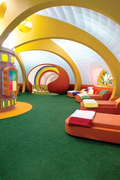 an indoor play area with brightly colored furniture