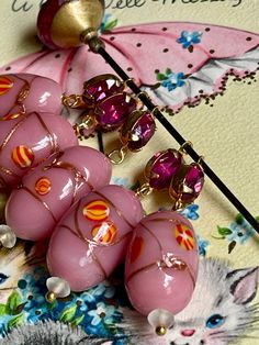 "This listing is for a set of beautiful glass drops that were assembled with components from a vintage necklace. The beads are glass and the pink rhinestone is glass as well. Quantity: 5 Size: 2 1/2\" long 🌺 Click here to return to my shop:  https://www.etsy.com/shop/VintageRoseFindings 🌸 favorite our shop for updates  🌿Instagram@vintagerosefindings (copy and paste link) 🌸Please visit my our other shop where we sell finished jewelry: https://www.etsy.com/shop/NellieGray" Pink Glass Party Jewelry, Pink Glass Jewelry For Jewelry Making, Pink Jewelry With Dangling Beads For Celebration, Pink Czech Glass Jewelry For Party, Pink Czech Glass Party Jewelry, Handmade Pink Drop Necklaces, Vintage Pink Czech Glass Jewelry, Pink Dangle Jewelry With Faceted Beads, Pink Faceted Oval Beads Jewelry