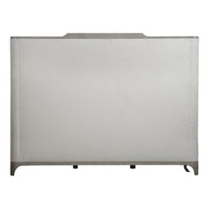 the back of a white cabinet with metal legs