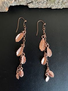 These delicate earrings were handmade from REAL tiny elm leaves. The set is made of ten unique leaves from tiny elm saplings. They are coated in copper using the electroforming process. The leaves range in size from 1/2 inch to 1/4 inch long (earrings are ~3 1/4 inches long including ear wire). Earrings will come packaged in a drawstring organza gift bag. Elm Leaf, Copper Electroformed Jewelry, Copper Uses, Lover Jewelry, Jewelry Nature, Real Leaves, Electroformed Jewelry, Jewelry Unique, Delicate Earrings