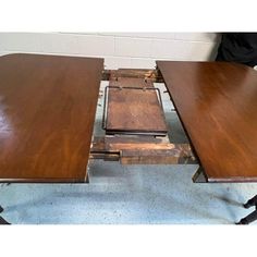 three wooden tables sitting on top of each other