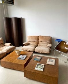 a living room with two couches and a coffee table in the middle is shown