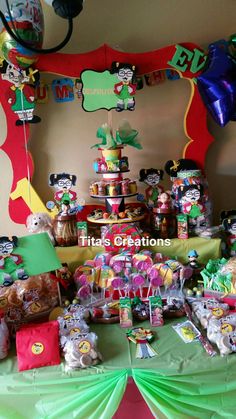 a table filled with lots of candy and decorations