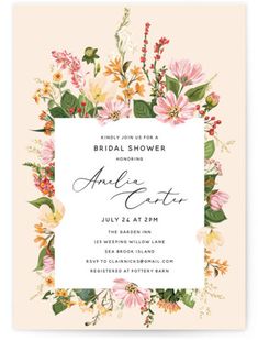 an elegant floral bridal shower party with pink and yellow flowers, greenery and foliage