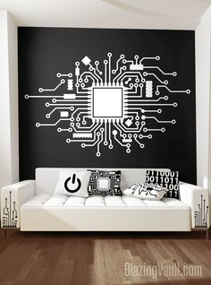 a living room with a couch and computer circuit board wall decal