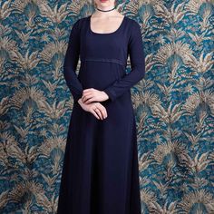 📏 Size 42 (L) 🎨 Midnight blue color ✂️Polyester crepe 🚿 machine washable at 30oC Long dress in midnight blue viscose/polyester crepe  Soft and fluid like silk, the Ann Elliott dress is a wise and sober dress.  With a cut, however, very inspired by the Regency period (England 1811-1820).  Its long, straight-cut sleeves and the waist are trimmed with tone-on-tone cotton lace.  The dress is cut flared and long, the back is slightly longer.  The back closes with a zip, the dress is cinched with t Regency Style Blue Dress With Historical Design, Blue Regency Style Floor-length Dress, Blue Regency Style Evening Dress, Elegant Fitted Blue Medieval Dress, Elegant Blue Medieval Dress, Regency Style Long Sleeve Medieval Dress, Regency Style Medieval Dress With Fitted Bodice, Jane Austen Style, Vintage Ball Gown