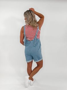 Get ready to romp in style with the Cove Denim Romper. Made from high-quality cotton denim, this piece features stylish seam detailing, adjustable straps for the perfect fit, and convenient front pockets for all your essentials. Say hello to your new favorite go-to outfit! Length: 33" Inseam: 4" Adjustable Straps Front Pocket Relaxed Fit Color May Vary From Different Viewing Device Runs True to Size with a Relaxed Fit Amy is 5'4", 34B, 3/26 Wearing a Size Small Berkley is 6 Months Pregnant in th Casual Cotton Denim Vest With Pockets, Dark Wash Denim Vest With Pockets For Day Out, Summer Trendy Denim Jumpsuit With Adjustable Straps, Trendy Summer Denim Jumpsuit With Adjustable Straps, Casual Relaxed Fit Shortalls For Day Out, Everyday Dark Wash Overalls With Pockets, Casual Summer Denim Vest With Pockets, Trendy Cotton Denim Vest With Pockets, Summer Utility Cotton Denim Vest