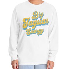 This Big Jaguar Energy Long Sleeve T-Shirt is made with 100% US cotton (Athletic Heather is 90% US cotton 10% polyester). This unisex long-sleeve shirt is a highly versatile choice that stays comfy throughout the day. Their tubular shape provides an easy-going, classic fit that is perfect for any occasion while the ribbed cuffs help maintain the garment's good looks for longer.  .: 100% US Cotton (fiber content may vary for different colors) .: Medium fabric (6.0 oz/yd² (203 g/m .: Classic fit . Fan Apparel Long Sleeve Relaxed Fit T-shirt, Collegiate Long Sleeve T-shirt With Relaxed Fit, Long Sleeve Cotton T-shirt With Team Name, Sporty Long Sleeve T-shirt With Logo Print, Long Sleeve T-shirt With Team Name For Fans, Collegiate Long Sleeve T-shirt For College, Long Sleeve Top With Team Name For Fall, Fan Apparel Long Sleeve Top With Logo Print, Long Sleeve Logo Print Fan Apparel Top