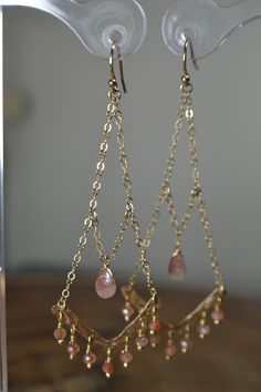 "These Oregon Sunstone Chandelier Earrings display hand formed components against Beautiful and Sparkly Sunstone beads. The featured gemstone reveals beautiful golden speckling in smooth rondelles and a focal Oregon Sunstone Briolette. Earrings are displayed in 14k Gold Fill; they are also available in 14k Rose Gold Fill and Sterling Silver. Personally, I recommend the Gold as the metal accents the Sunstone nicely. These Earrings add a touch of drama to your \"Everyday\" but will carry you into Chic Statement Earrings, Diy Earrings For Beginners, Chandelier Earrings Diy, Chandelier Long, Sunstone Earrings, Briolette Earrings, Nose Ring Jewelry, Earrings Display, Neck Pieces Jewelry